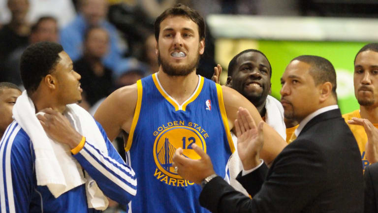 Aussie connection: Jackson (second right) coached Andrew Bogut and the Warriors before going into broadcasting.