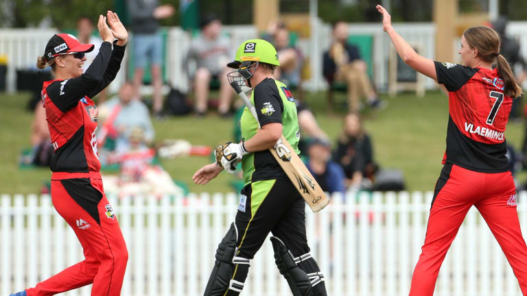 Sent packing: Melbourne bowler Tayla Vlaeminck (right) celebrates with team mate Lea Tahuhu after taking the wicket of Sydney's Rachel Priest.