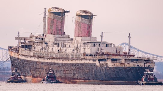 The ship departs Philadelphia on its final voyage to become an artificial reef off Florida.
