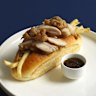 The roast chicken roll with house-made stuffing and fried chicken skin.