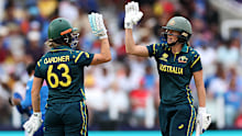 Ash Gardner celebrates her half-century with Ellyse Perry.