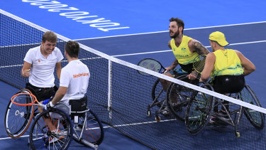 Sam Schroder and Niels Vink of the Netherlands celebrate winning a gold medal against Dylan Alcott and Heath Davidson in the men’s quad doubles tennis event. 