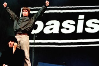 Noel and Liam Gallagher salute the crowd at the first of two sell-out concerts at Loch Lomond in Scotland.