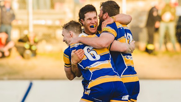 Woden Valley Rams second-rower Bradley Martin, middle,  showed his compassion  by coming to aid of unconscious Tuggeranong fullback Matthew Gruber.
