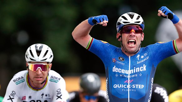 Mark Cavendish celebrates after winning the fourth stage of the Tour de France.