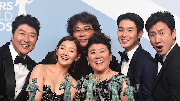 Kang-Ho Song, from left, Park So-dam, Bong Joon-ho, Jang Hye-jin, Choi Woo-shik, and Lee Sun Gyun of <i> Parasite </i>.
