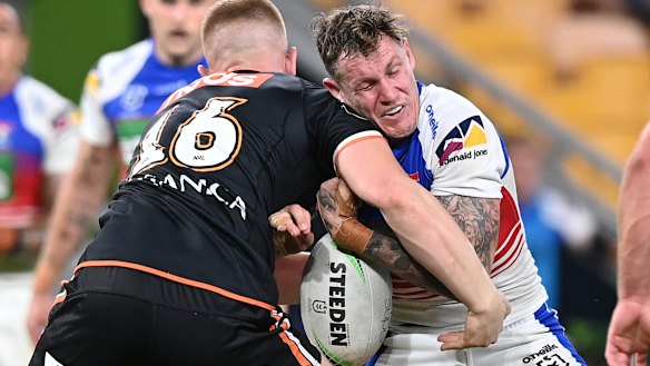 Kurt Mann gets hammered by the Tigers defence.