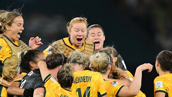 A night for the ages: The Matildas come together after the winning penalty.