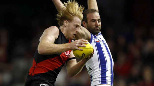 Essendon defender Aaron Francis in action against North Melbourne at Marvel Stadium.