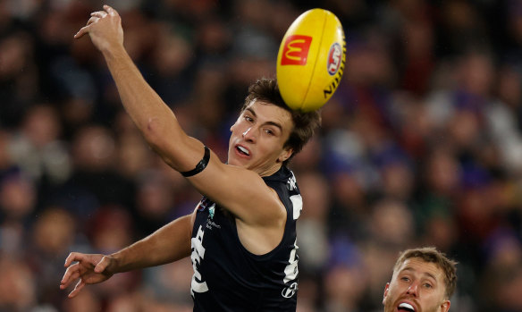 The goal umpire thought Caleb Marchbank touched Christian Petracca’s late shot.