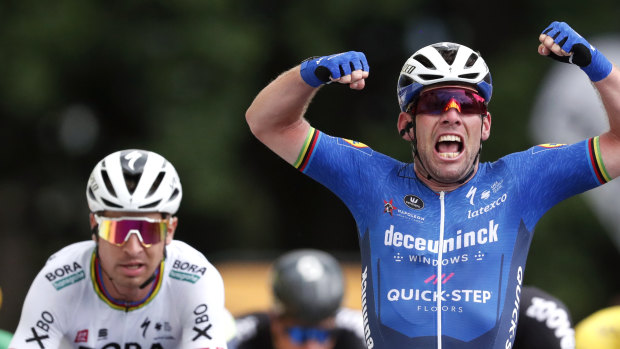 Mark Cavendish celebrates after winning the fourth stage of the Tour de France.
