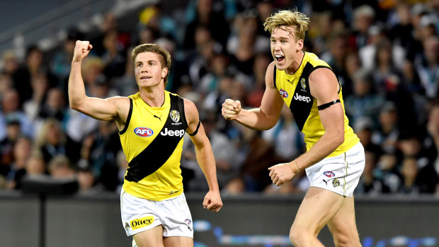 Liam Baker and Tom Lynch of the Richmond Tigers celebrate a goal.