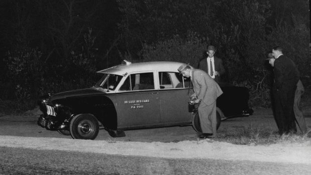 "Detectives examining the scene, where Dudley William Woodgate, 26, taxi-driver, of Bondi, was murdered yesterday afternoon. April 30, 1959."