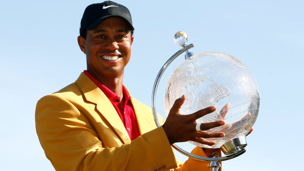 Tiger Woods with the spoils of victory at the 2009 Australian Masters.