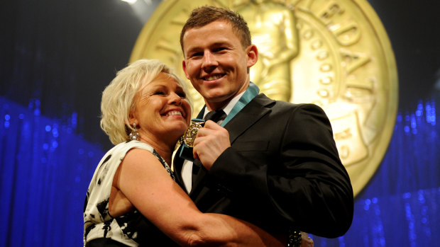 England-bound: Toss Carney with mother Leanne after his Dally M medal win in 2010.