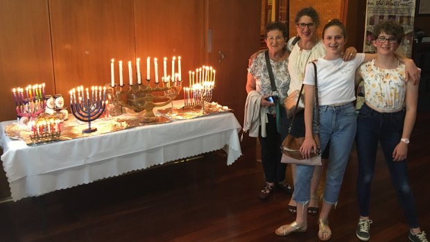 Sara Hall's family brought their wooden candelabrum (the biggest) to usher in the final night of Hanukkah on Sunday.