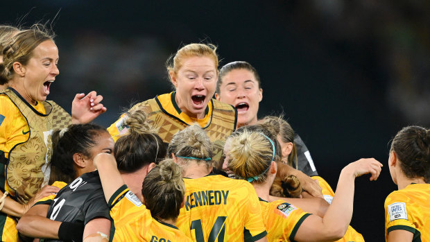 A night for the ages: The Matildas come together after the winning penalty.