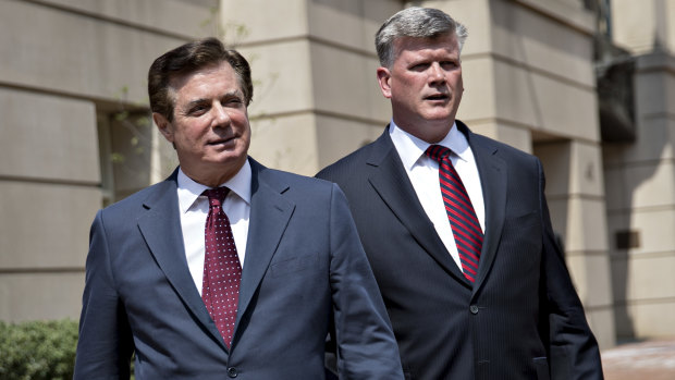 Paul Manafort exits the District Courthouse after a motion hearing in Virginia with his lawyer this month.