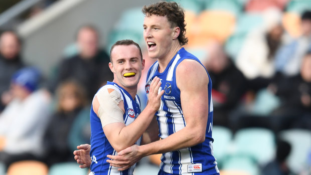 Jack Mahony and Nick Larkey celebrate a goal for the Roos.