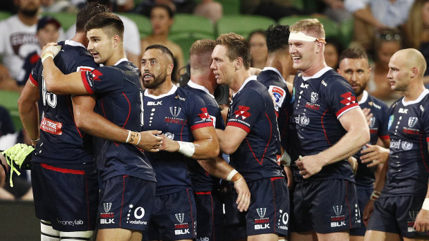 Rebels players celebrate their win over the 
 Highlanders last Friday.