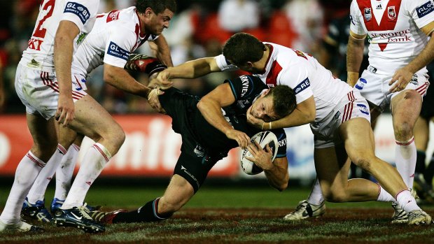 Nick Youngquest is tackled while playing for the Panthers in 2007.