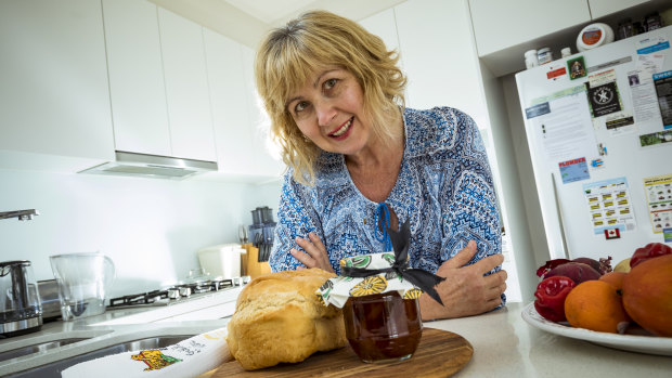 Roni Burger with a loaf of freshly baked bread she has made for her neighbour. 