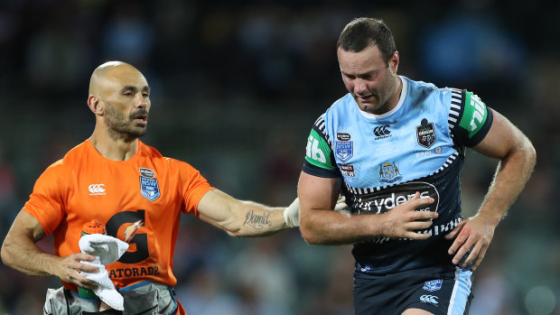 Boyd Cordner is assisted from the field after suffering a head knock in the opening State of Origin clash in 2020.