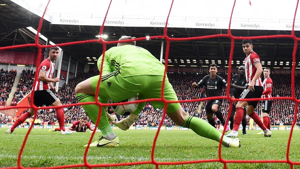 Blades keeper Dean Henderson allows the ball to squeeze past him for Wijnaldum's fortuitous goal.