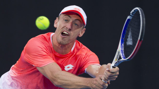 Straight through: John Millman reaches for a return against No.7 seed Marton Fucsovics of Hungary.