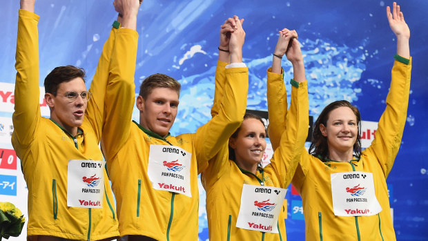 Strong start: Mitch Larkin (left) celebrates during the medal presentation of the 4x100m Medley Relay Final.