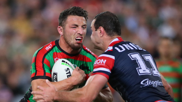 Sam Burgess (left) in action during Friday night's fiery clash with the Roosters.