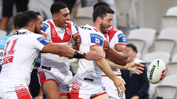 The Dragons celebrate Ben Hunt’s first-half try.