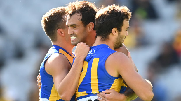 Brendon Ah Chee celebrates a goal with his West Coast teammates at the MCG.