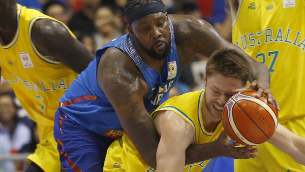 Australia's Mathew Dellavedova, who also plays for the NBA's Bucks, is fouled against the Philippines.