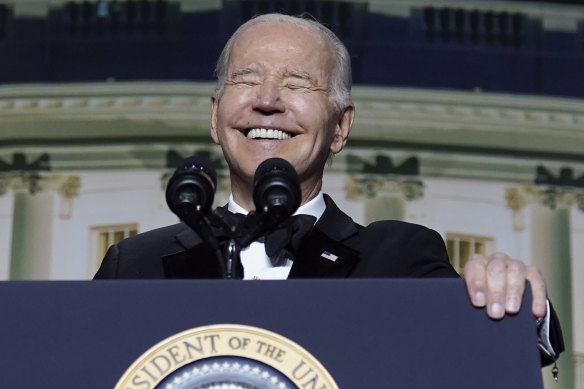 US President Joe Biden laughs at his own expense at the White House Correspondents’ Association dinner last month.