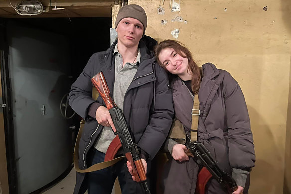 Ukrainian citizens Yaryna and Sviatovslav Fursin, who got married just hours after Russia launched its invasion of their country. They spent their first day as a married couple collecting their rifles and getting ready to defend Ukraine.