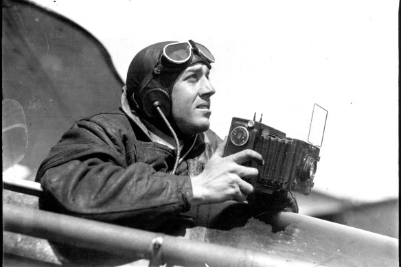 Herald Melbourne photographer takings snaps during air search. April 4, 1931.