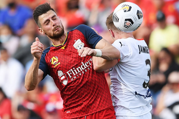 Tomi Juric, left, and Scott Jamieson, right, in action in Adelaide. 