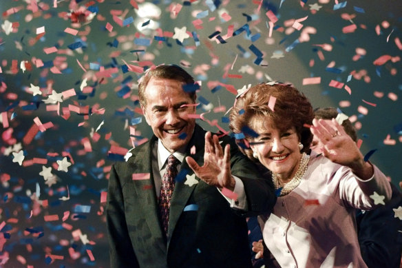Bob Dole and his wife Elizabeth wave from the podium on the floor of the Republican National Convention in San Diego in 1996.  