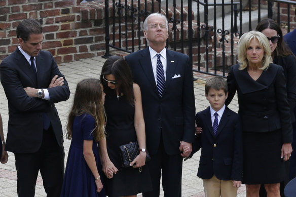 Joe Biden prepares to enter a vigil for his son, Beau Biden, who died of brain cancer aged 46 in 2015. Hunter Biden is at the far left.