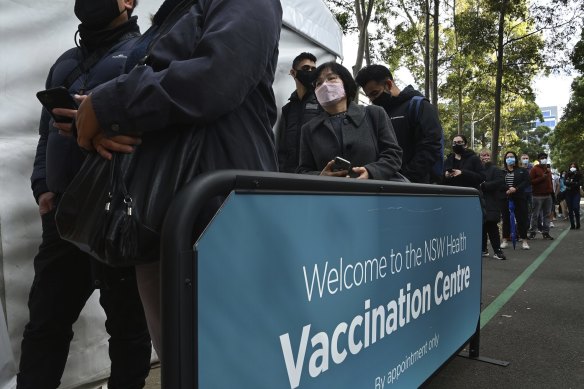 A queue for COVID-19 vaccinations at Olympic Park in late June.