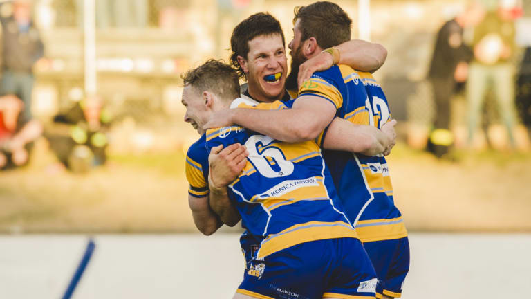 Woden Valley Rams second-rower Bradley Martin, middle,  showed his compassion  by coming to aid of unconscious Tuggeranong fullback Matthew Gruber.