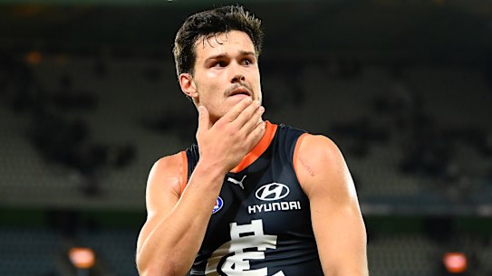 Jack Silvagni leaves the field after the loss to Brisbane, during which Blues fans voted with their feet last.
