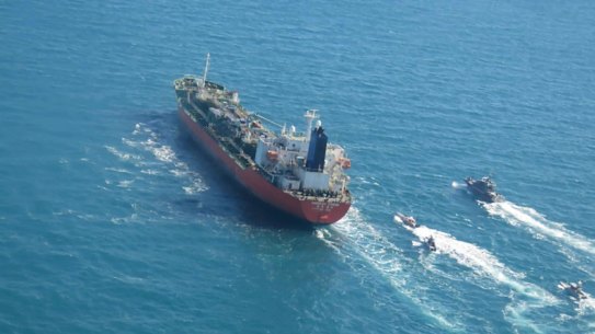The South Korean-flagged tanker MT Hankuk Chemi is escorted by Iranian Revolutionary Guard boats in the Persian Gulf.