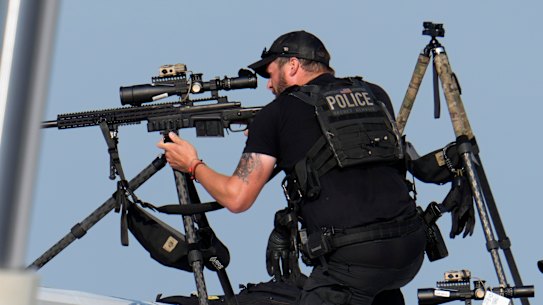 Police snipers take aim after shots were fired while Republican presidential candidate former President Donald Trump was speaking at a campaign event in Butler, Pennsylvania.