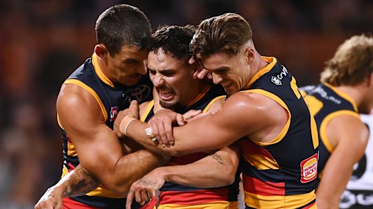 Taylor Walker (left) with Izak Rankine (centre).