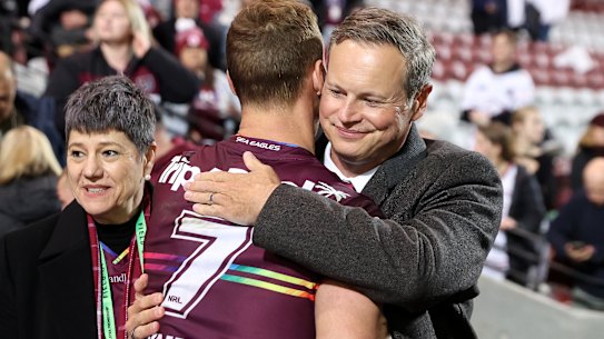 Daly Cherry-Evans embraces Manly owner and chairman Scott Penn. 