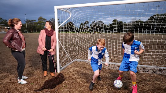 Team manager of Hurlstone Park Wanderers FC Catherine Field, Under 9s and coach Cara Wood with their sons playing at their home ground.