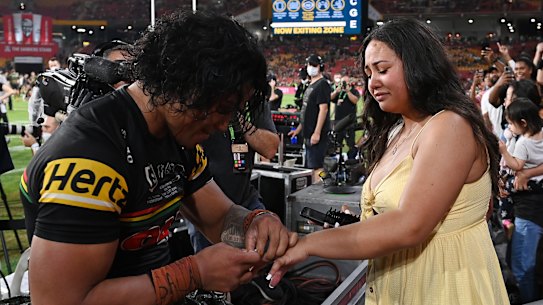 Brian To’o of the Panthers proposes to his partner Moesha Fui fui after winning the grand final in Brisbane.
