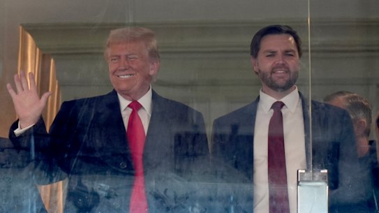 President-elect Donald Trump, left, and Vice President-elect JD Vance attend the NCAA college football game between Army and Navy at Northwest Stadium in Landover, Maryland.
